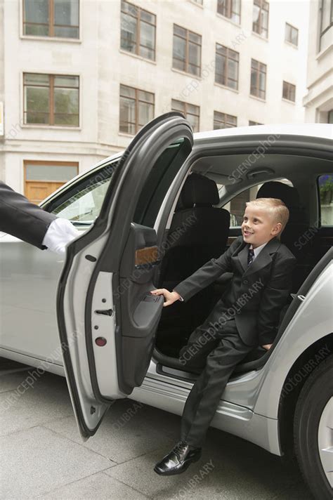 Young Businessman Exiting Car - Stock Image - F003/5127 - Science Photo Library