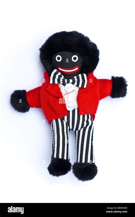 A gollywog golliwog golly wog minstrel toy doll figurine on a white Stock Photo: 22696500 - Alamy