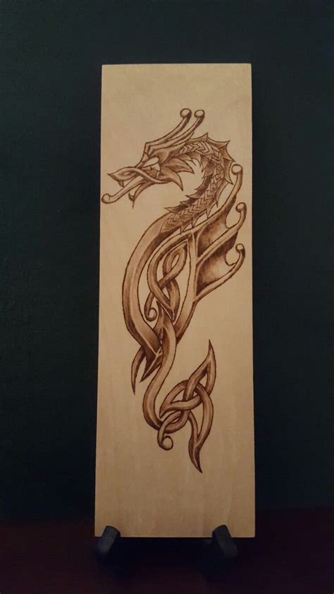 Woodburned celtic dragon pyrography | Wood burning art, Pyrography art, Pyrography patterns