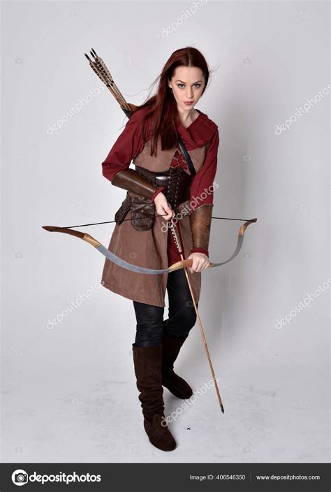 Full Length Portrait Girl Red Hair Wearing Brown Medieval Archer Stock Photo by ©faestock 406546350