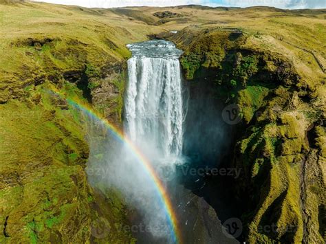 Famous Skogafoss waterfall with a rainbow. Dramatic Scenery of Iceland ...