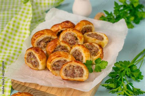 Puff pastry mini sausage rolls with ground beef Stock Photo | Adobe Stock