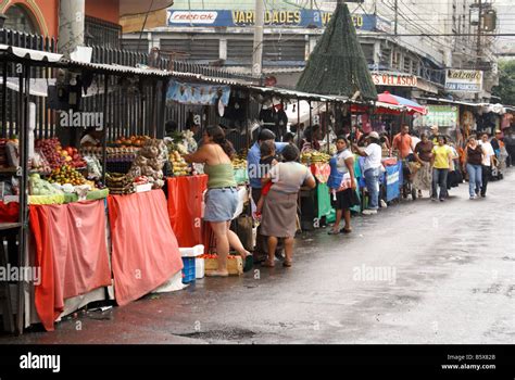 Fruit and produce stalls lining a street in downtown San Salvador, El ...