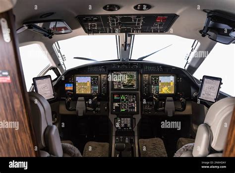 Aircraft interior, view into the cockpit of a modern turboprop aircraft ...