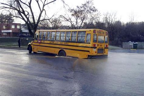 Scary sinkhole eats school bus, kids somehow OK