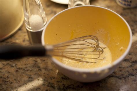Metal whisk in a mixing bowl - Free Stock Image