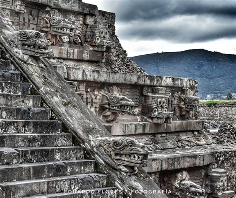 an ancient building with many carvings on the side and steps leading up to it's top