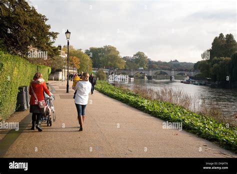 The Thames path at Richmond, London England - family walking on an ...