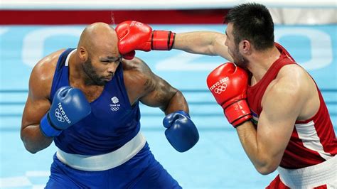 Frazer Clarke earns Olympic bronze after a cut ends his super-heavyweight semi-final against ...