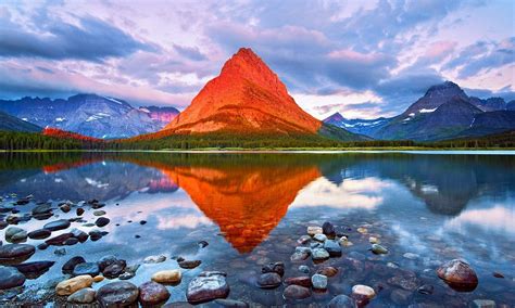 Photographer Harry Litchman's sunrise image transforms grey Montana mountain into glowing orange ...