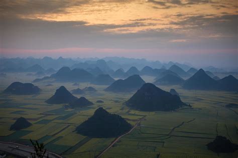 Yellow rapeseed flower field in Luoping, China 9566572 Stock Photo at Vecteezy