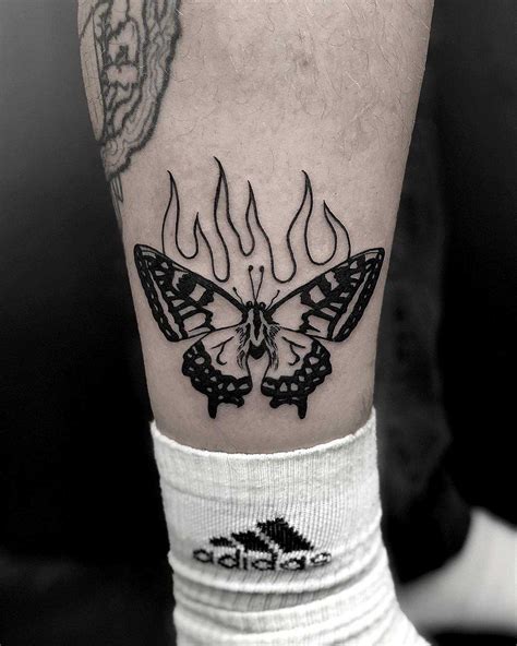 Burning butterfly tattoo by Loz McLean - Tattoogrid.net