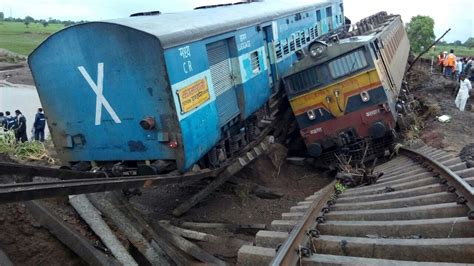 Twin trains veer off bridge in India killing dozens - CNN