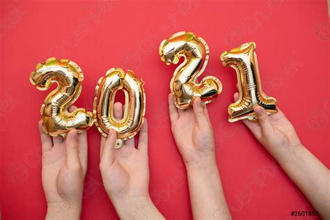 Golden new year numbers-balls 2021 held by people at - stock photo ...