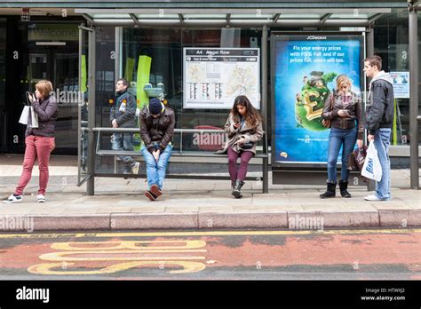 People waiting at a bus stop, Nottingham, England, UK Stock Photo - Alamy