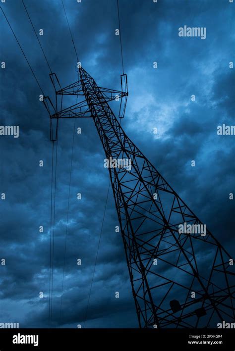 electrical tower and clouds at night Stock Photo - Alamy