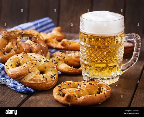 Oktoberfest salted soft pretzels in a bowl and beer from Germany on wooden background Stock ...