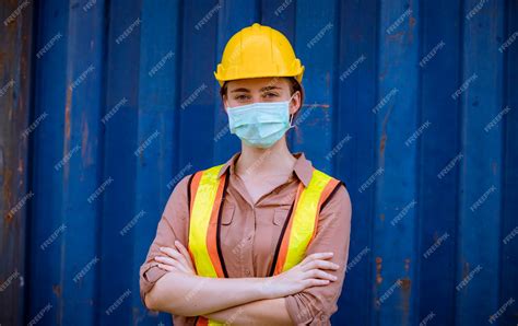 Premium Photo | Portrait team dock workers posing under working and checking production process ...