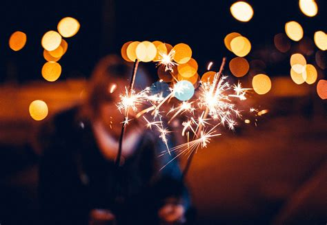 Woman Holding Sparklers in Hands Free Stock Photo | picjumbo