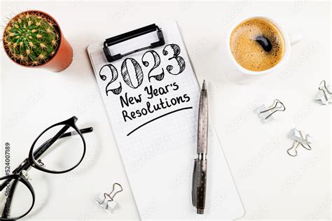 New year resolutions 2023 on desk. 2023 resolutions list with notebook ...