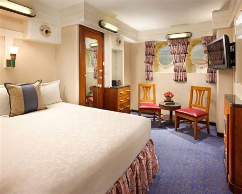 The standard stateroom with authentic porthole and full size bed about ...