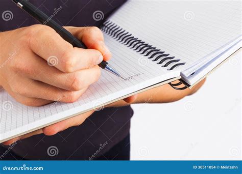 Boy writing in a book stock photo. Image of hair, light - 30511054