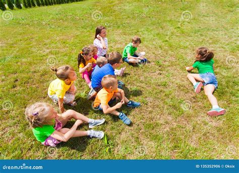 Top View of Group of Children Playing on Grass Stock Photo - Image of friends, charades: 135352906