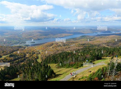 Aerial view of Lake Tremblant and Mont-Tremblant village in fall with fall foliage, from top of ...