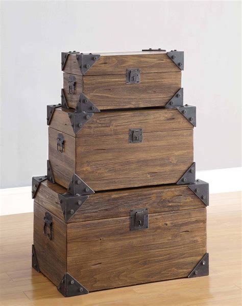 three wooden trunks stacked on top of each other