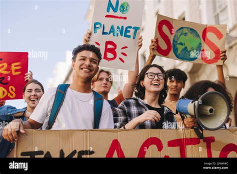 Generation Z environmental activism. Happy young people holding posters ...