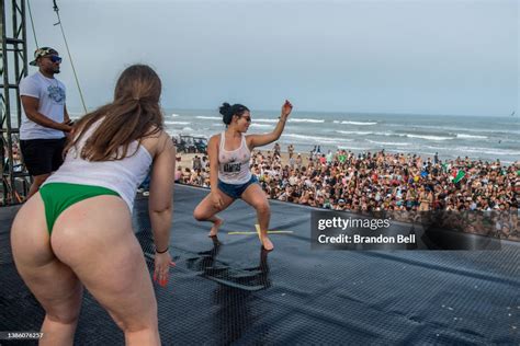 A woman dances on stage at a party during the South Padre Spring ...