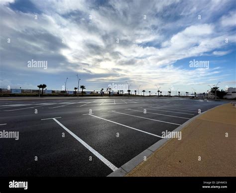 Empty parking lot with sunrise sky in the background Stock Photo - Alamy