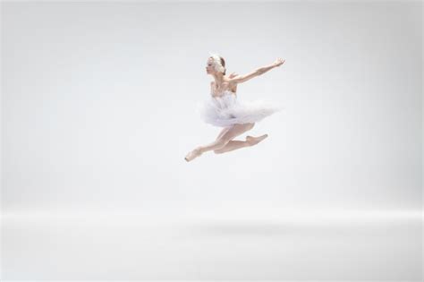 Free Photo | Young graceful ballerina on white studio background