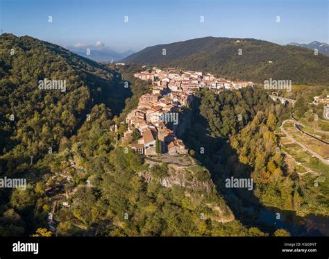 Aerial view of Castellfollit de la Roca cliff village in Catalonia ...