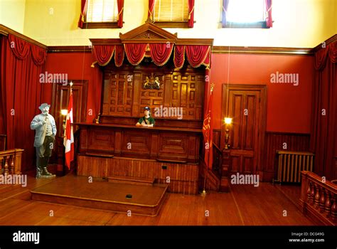 Female tourist sitting judge bench former assizes courtroom heritage ...