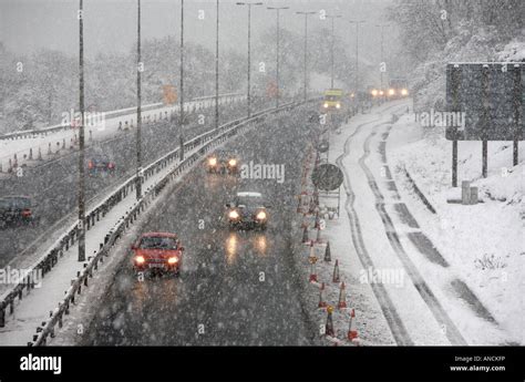 cars in traffic driving along the M2 motorway outside Belfast during heavy snowstorm Stock Photo ...