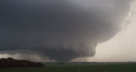 A Massive Wedge-shaped Tornado Looms Above Nebraska Farmland Stock Footage Video 26876683 ...