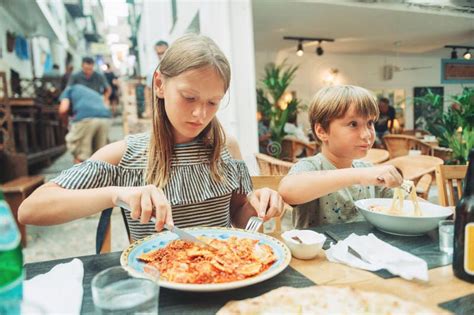 Two Funny Kids Having Lunch in the Restaurant Stock Image - Image of ...