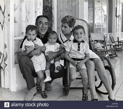 an old black and white photo of a family posing for the camera with ...