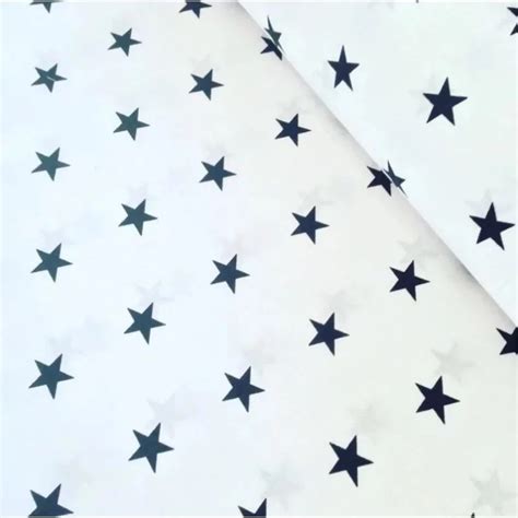 Cotton poplin fabric with white stars on navy blue background