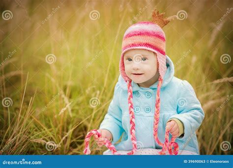 Baby Girl with Down Syndrome Looks Surprised Stock Image - Image of baby, autumn: 39690063