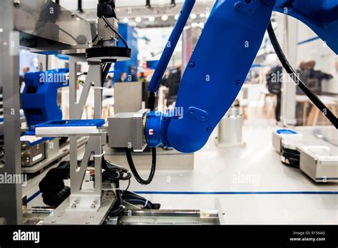 Robot arm in assembly line Stock Photo - Alamy