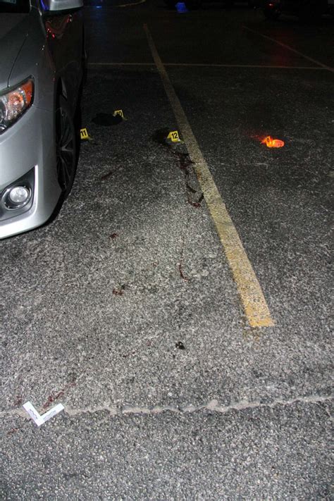 Graphic crime scene photos show aftermath of gun battle outside strip club involving Texas officer