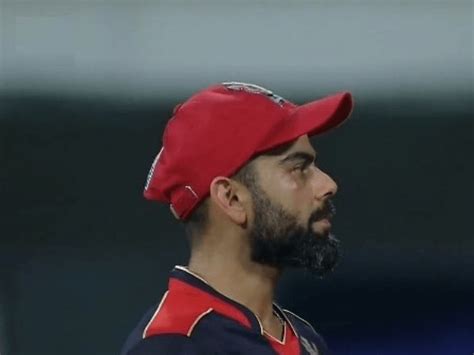 IPL 2021 : Virat Kohli Injured while fielding in IPL opener against MI