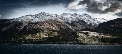 Mountains at Lake Wanaka – Stuck in Customs