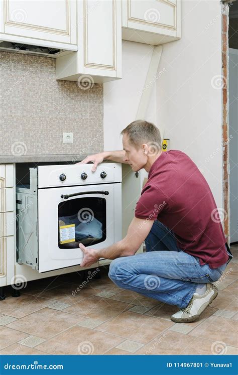 Installation of the Built-in Electric Oven. Stock Image - Image of ...