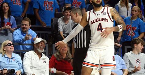 Auburn star Johni Broome bats away a spectator’s hand before realizing ...