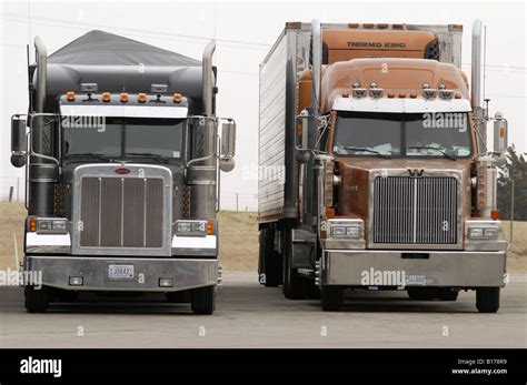 Two semi tractor trucks with trailers at a truckstop on Interstate 40 ...