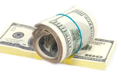 Premium Photo | Stack of money- cash of US dollars isolated on white wall