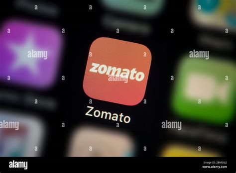 A close-up shot of the Zomato app icon, as seen on the screen of a ...